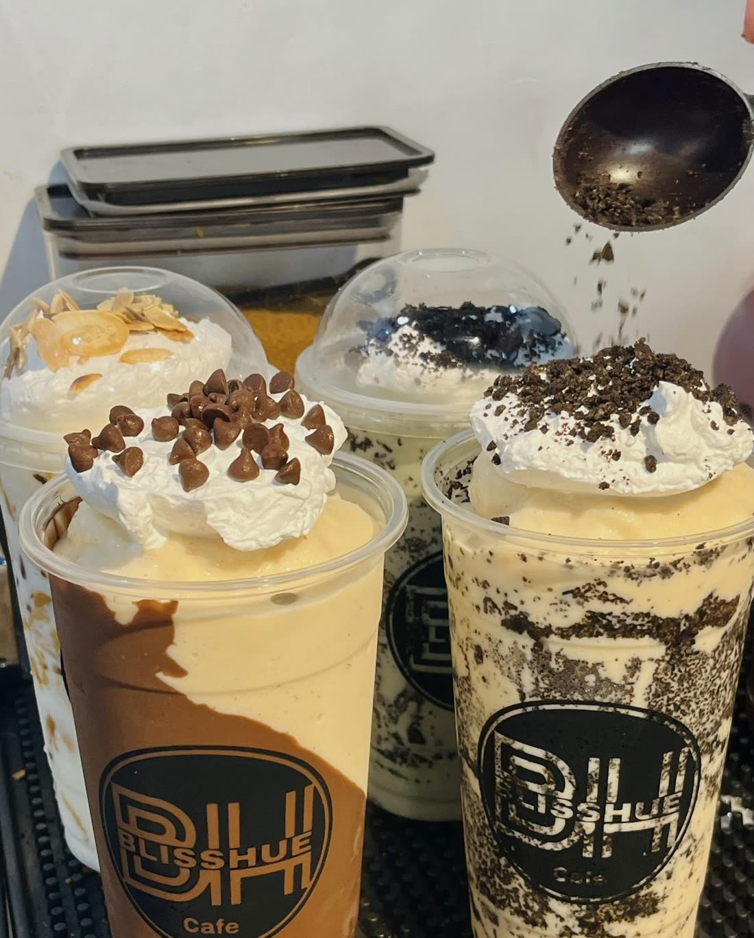 Frappes topped with whipped cream, chocolate chips and cookie crumbs at the Blisshue counter